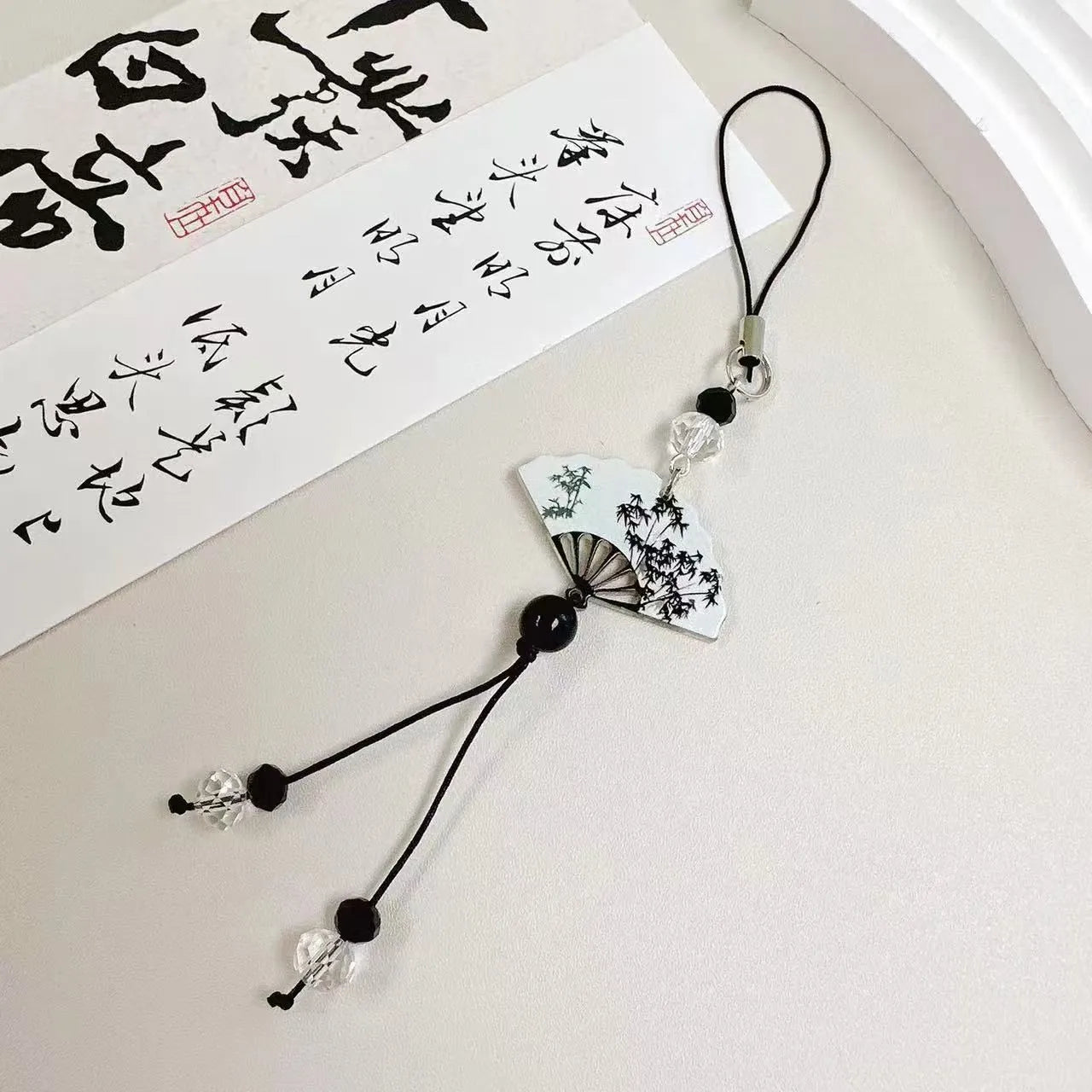Guofeng style bead keychain with floral pattern and baked varnish finish in Fan colour.