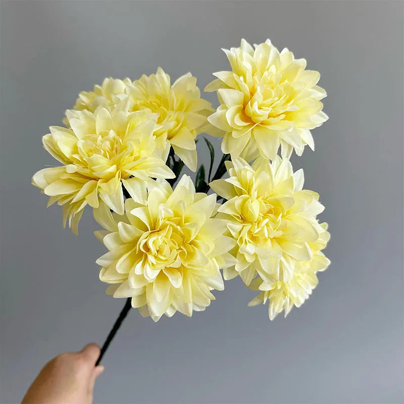 Desktop fan-shaped display holding artificial silk flowers in rose and peony varieties with colourful petals
