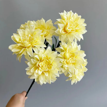 Desktop fan-shaped display holding artificial silk flowers in rose and peony varieties with colourful petals