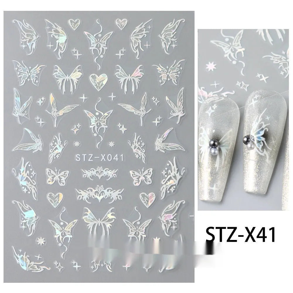 Assortment of black and silver nail sticker designs including cartoon and French tip patterns on a plastic sheet.