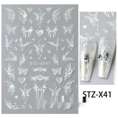 Assortment of black and silver nail sticker designs including cartoon and French tip patterns on a plastic sheet.