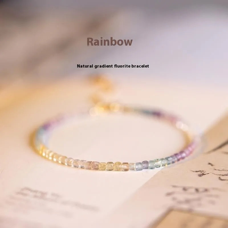 Handmade women's bracelet with rainbow fluorite stone in geometric copper links.