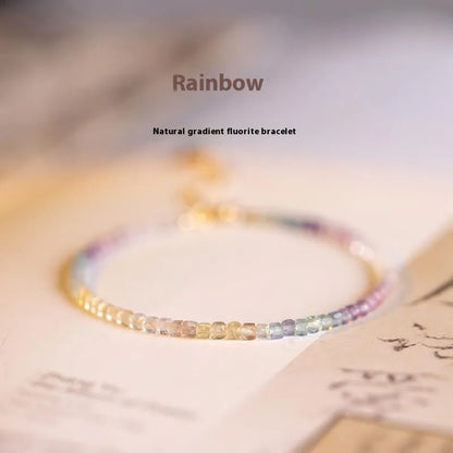 Handmade women's bracelet with rainbow fluorite stone in geometric copper links.