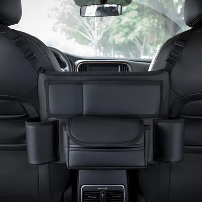 Black leather car seat gap storage bag hanging from armrest with tissue box, showing textured grain detail.