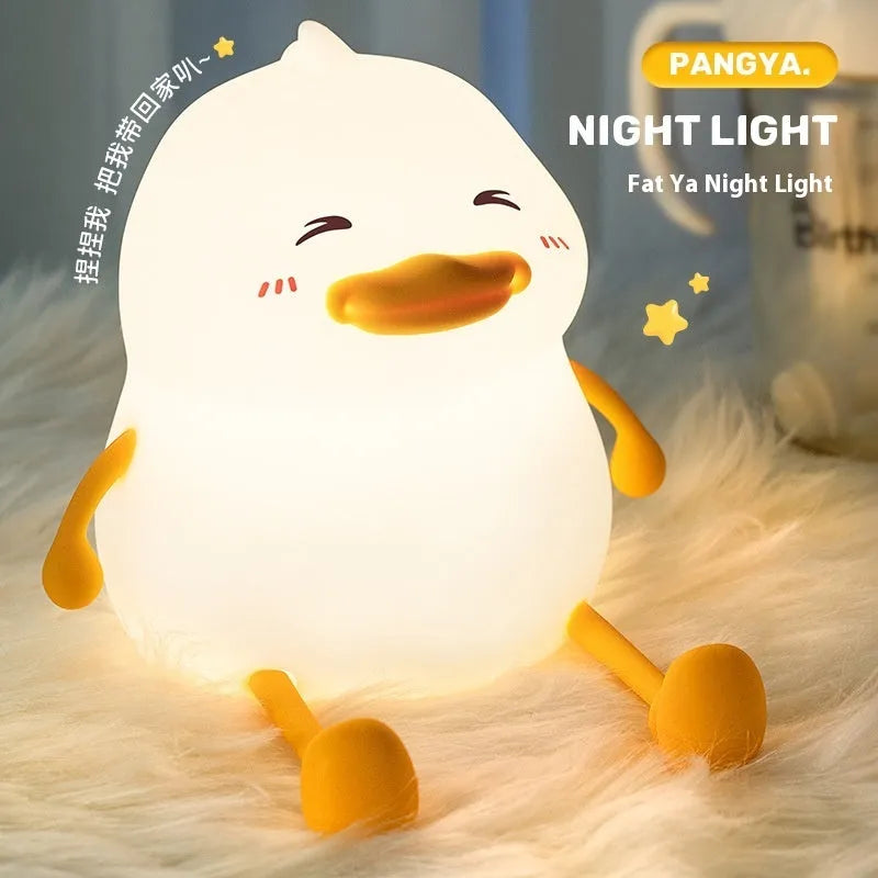Chubby Night Light with integrated phone holder, offering 7-22 hours of adjustable brightness from a 1200mAh battery for bedside reading or ambient lighting.