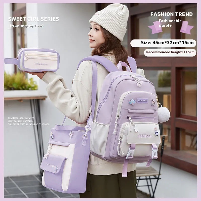 Pink girls school backpack with curved shoulder straps on a wooden floor