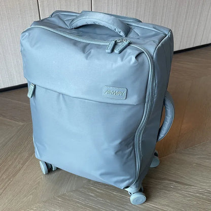 Ultra-light waterproof Oxford cloth suitcase in bluestone green with universal wheels showing 20-inch size dimensions