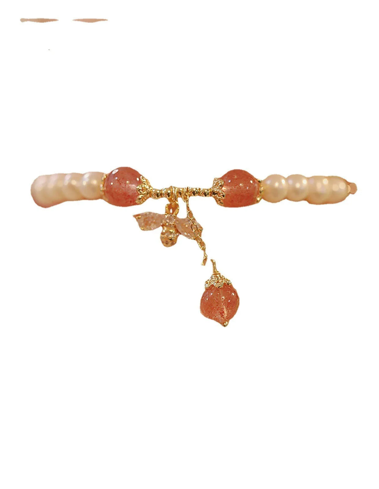Women's strawberry quartz crystal bracelet with a decorative bow charm on a wrist.
