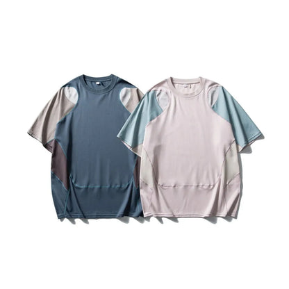 Man wearing a loose blue patchwork contrast colour short sleeve cotton blend sports t-shirt.