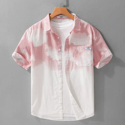Man wearing a light pink loose-fit pure cotton short sleeve casual shirt.
