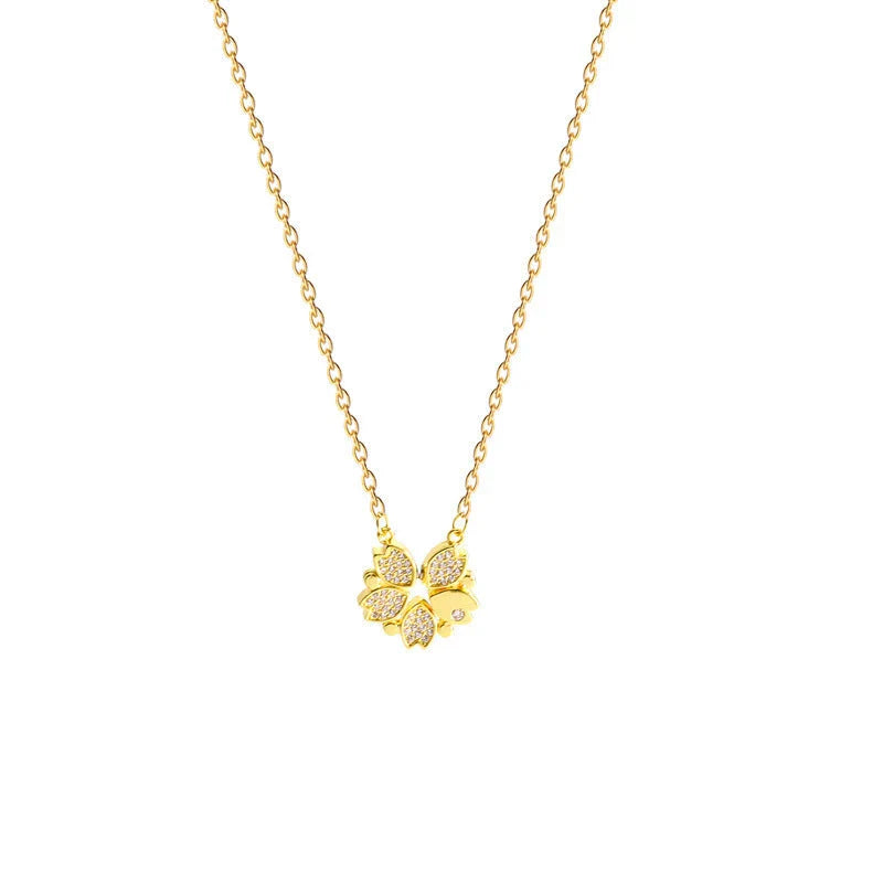 Exclusive four-leaf clover pendant necklace in stainless steel with crystal heart charm, a versatile jewellery piece for women