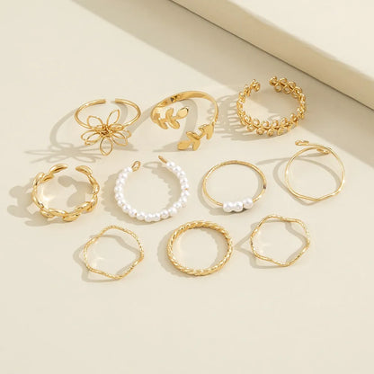 Gold openwork flower pattern ring set with electroplated glossy finish
