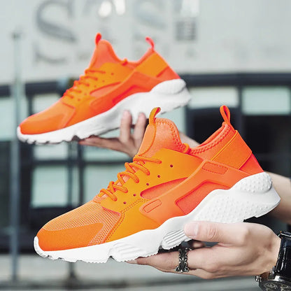 Men's low top casual shoes with mesh upper, cross shoulder straps, and flat heel in fluorescent colours