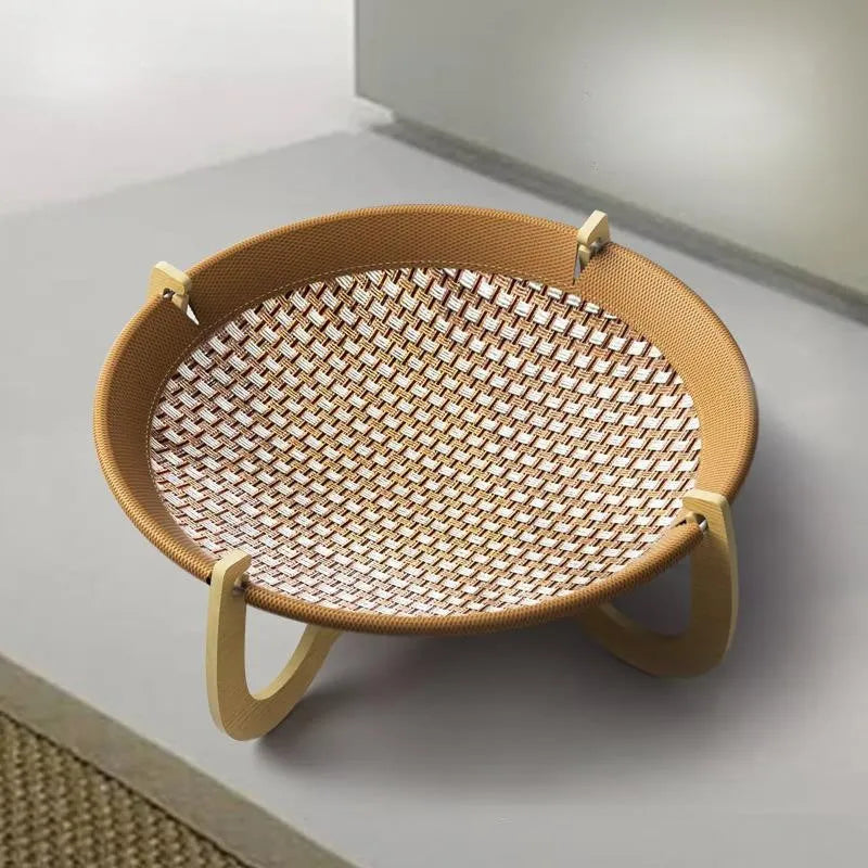 Brown woven rattan pet hammock bed for cats and small dogs on a flat surface.