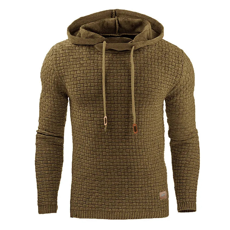 A man wearing a cotton-polyester blend hoodie available in nine colours including black, navy, and red.