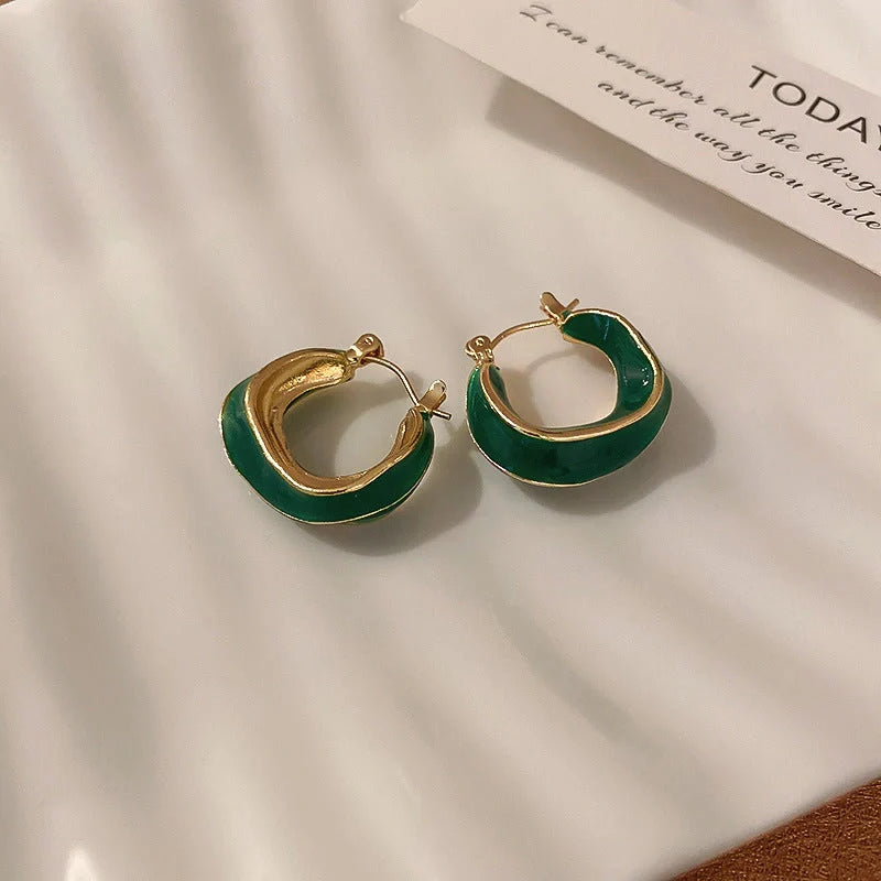 Stylish geometric earrings with dripping glaze in candy colours, perfect for adding a modern touch to any outfit.