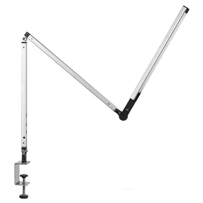 Adjustable aluminium desk lamp with remote control, shown in black with a clip attached to a desk edge.