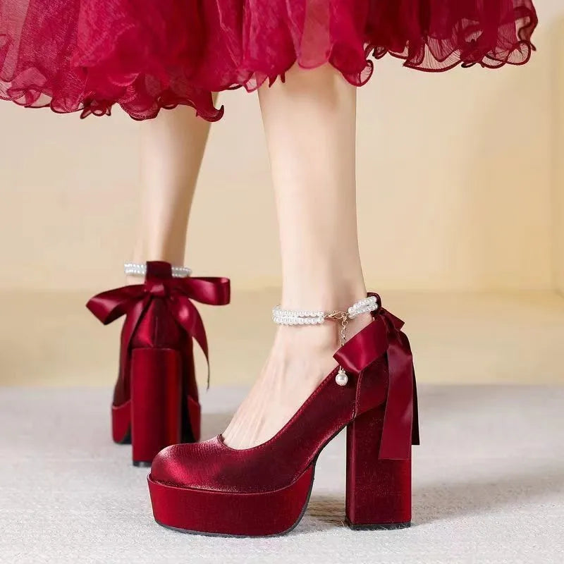 Women's waterproof wedding pumps with chunky heel in wine red colour featuring silk buckle detail