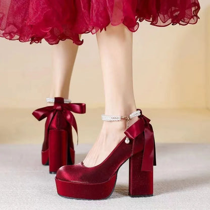 Women's waterproof wedding pumps with chunky heel in wine red colour featuring silk buckle detail