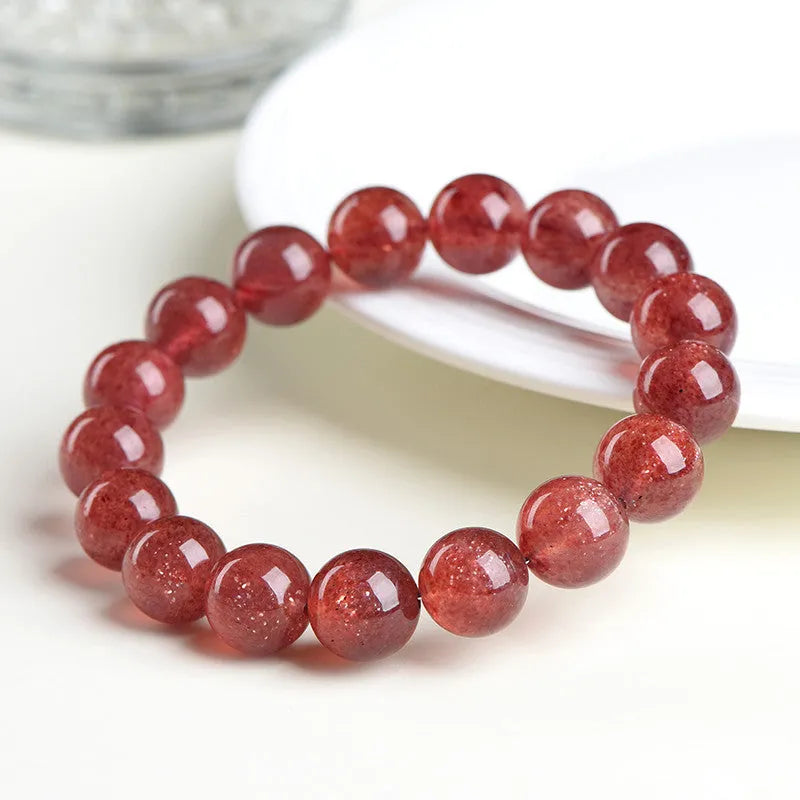Natural strawberry quartz bracelet with geometric beads in starlight red colour.