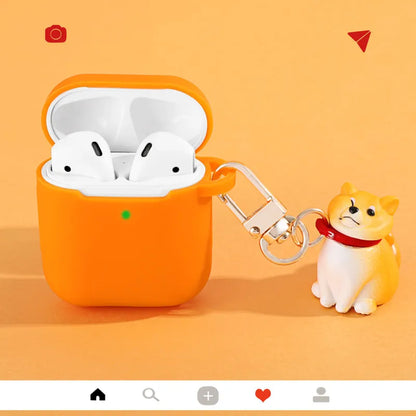 Silicone AirPods case with Shiba Inu pendant in yellow, white, or black, universal fit for AirPods 1 and 2.