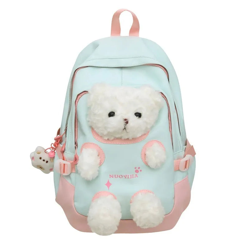 Macaron colour nylon school backpack with curved straps, shown in yellow pink, with a pendant attached.