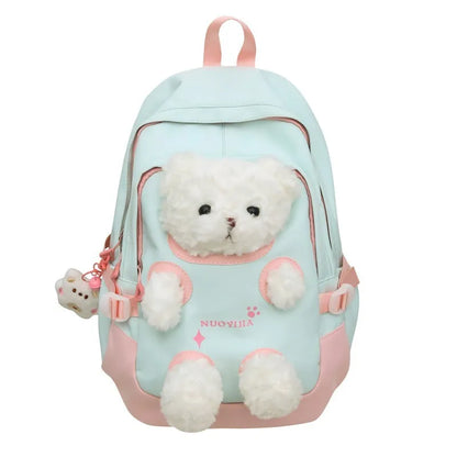 Macaron colour nylon school backpack with curved straps, shown in yellow pink, with a pendant attached.