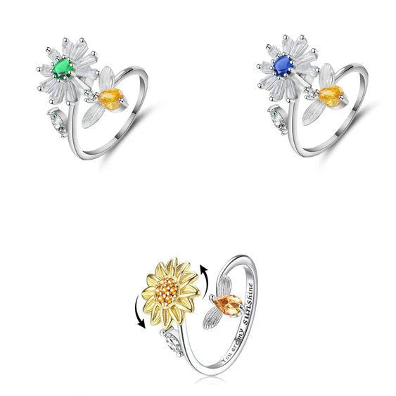Adjustable spinner ring with rotating floral, geometric, and nature-inspired motifs for women's fashion and stress relief