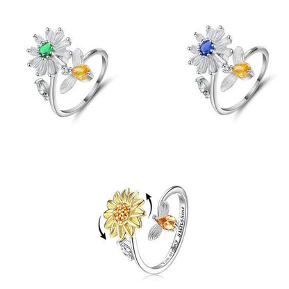 Adjustable spinner ring with rotating floral, geometric, and nature-inspired motifs for women's fashion and stress relief