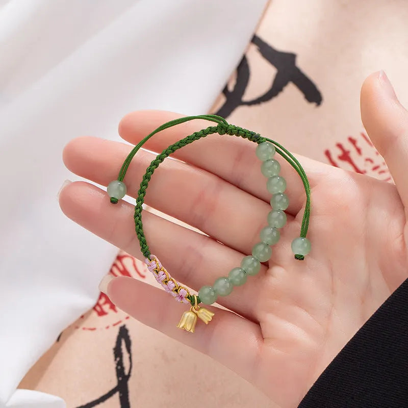 Lily carrying strap hand woven bracelet for women featuring national style flower design with red rope construction and adjustable fit
