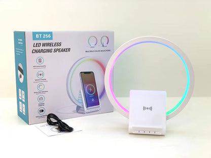 White smart Bluetooth speaker with ambience light and wireless charging pad
