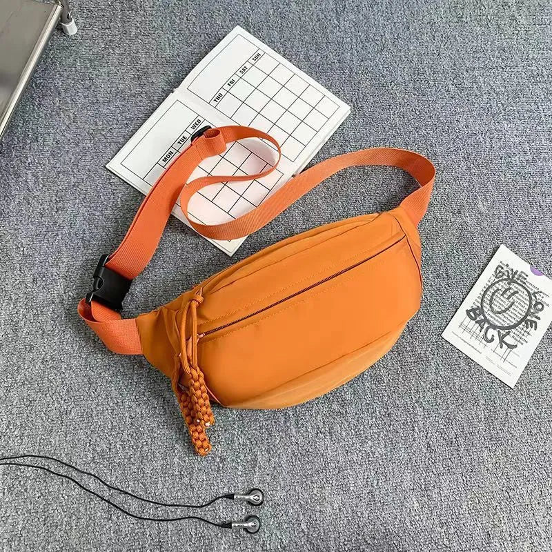 Men's small black polyester crossbody chest bag with adjustable strap.