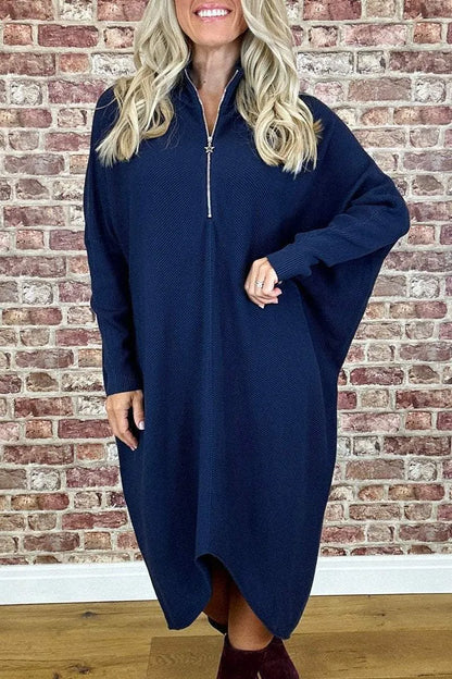 Women's solid colour loose knitted dress with a front zipper and raglan sleeves.