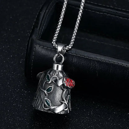 Polished titanium steel motorcycle bell with clear epoxy rose detail, shown from the side.