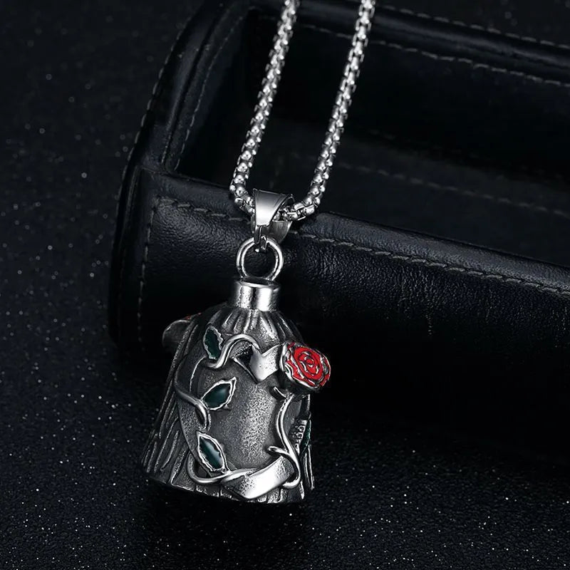 Polished titanium steel motorcycle bell with a double-sided epoxy rose design on a geometric shape.