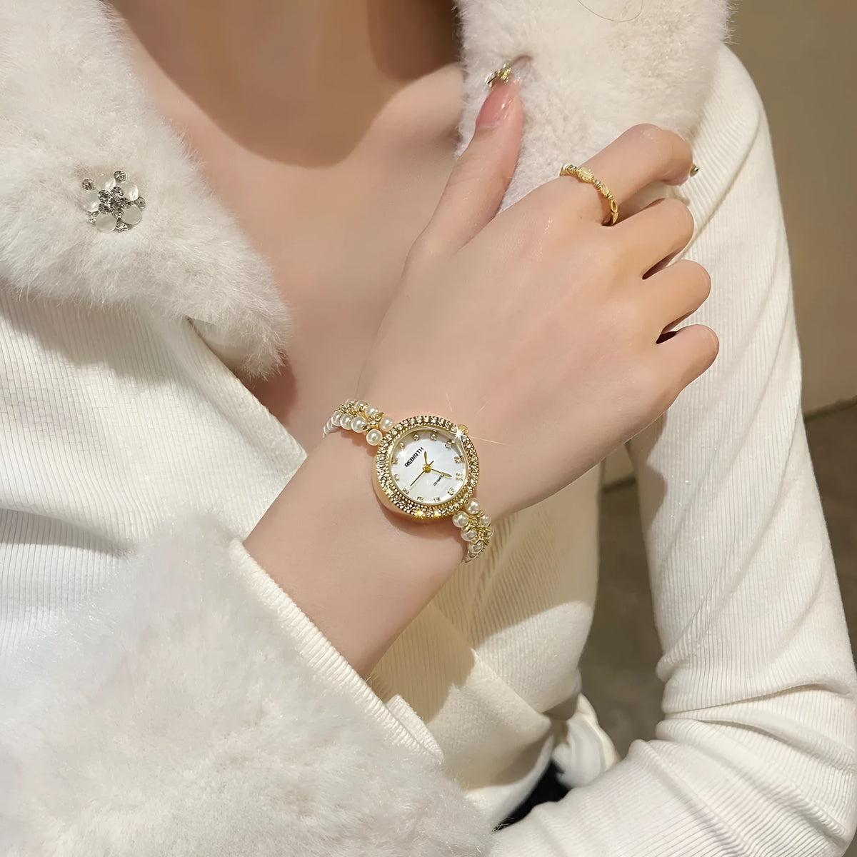 Women's vintage freshwater pearl bracelet watch with 25mm dial, steel strap, and double row pearl design in silver