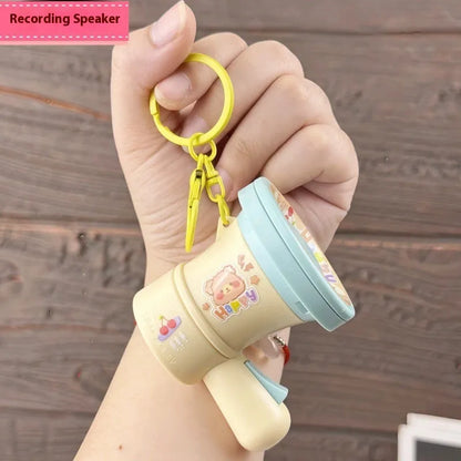 Green and yellow plastic cartoon horn keychain with recording function