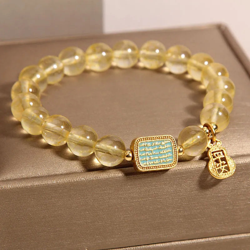 Women's natural yellow citrine crystal bracelet with rhinestone detailing.