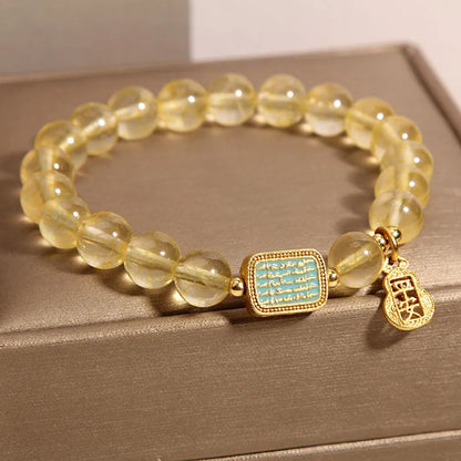 Women's natural yellow citrine crystal bracelet with rhinestone detailing.