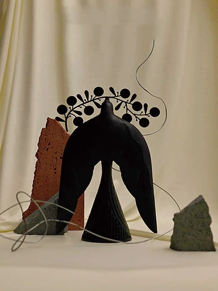 Handmade iron flying bird ornament measuring 240mm tall with ancient Chinese style details on wooden surface