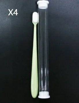 Micron soft toothbrush with coloured handles and different bristle styles including flat head and wavy designs