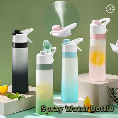 White spray water bottle with black leakproof lid and handle strap on a table