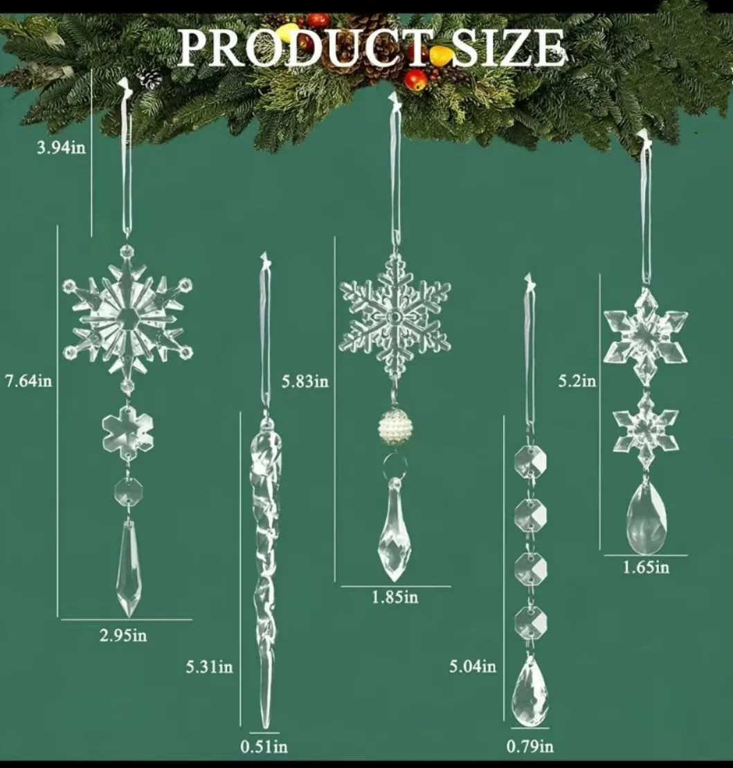 Set of ten clear acrylic icicle-shaped Christmas tree ornaments with white ribbons on green pine branches.