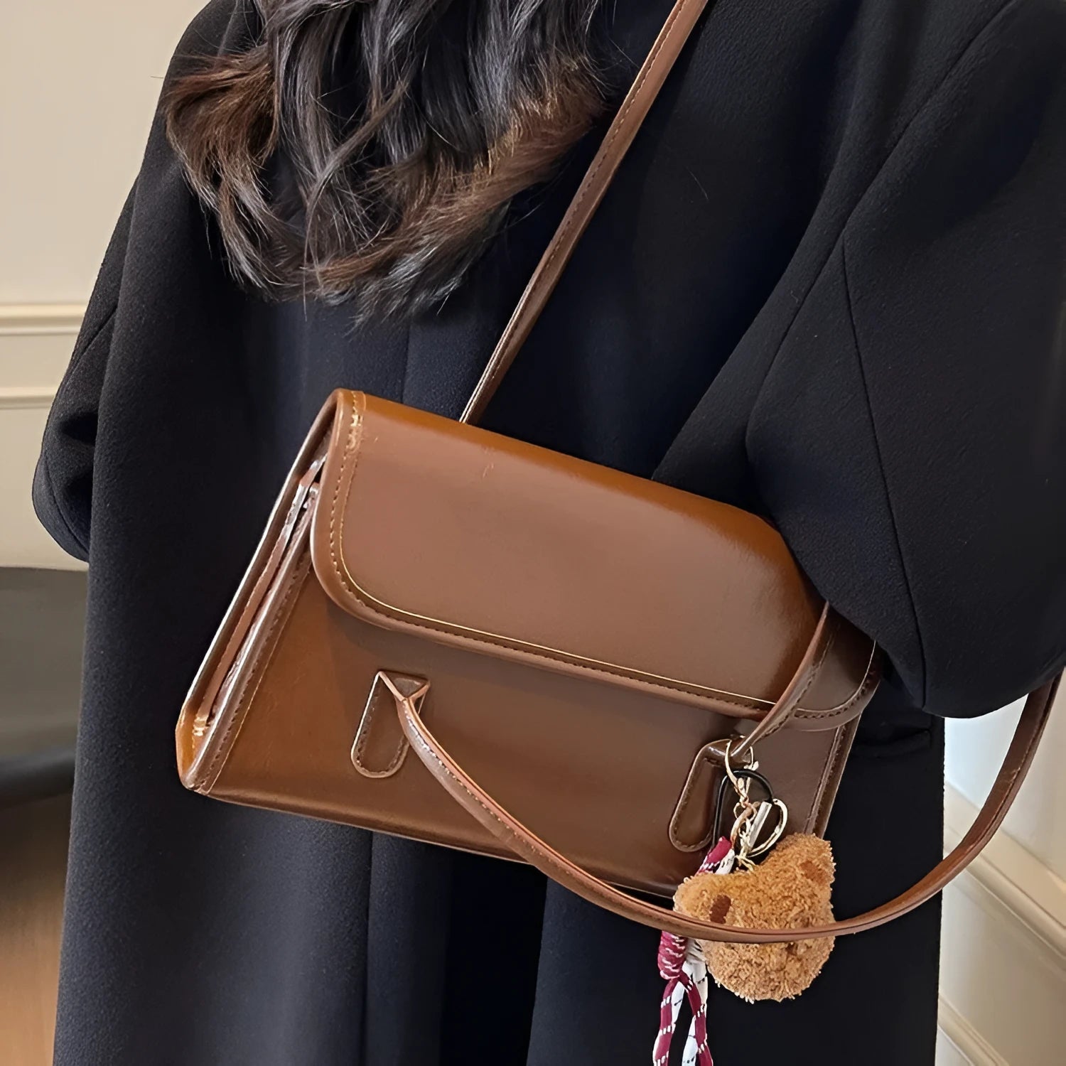 Brown women's square shoulder bag with double straps and pendant accessory