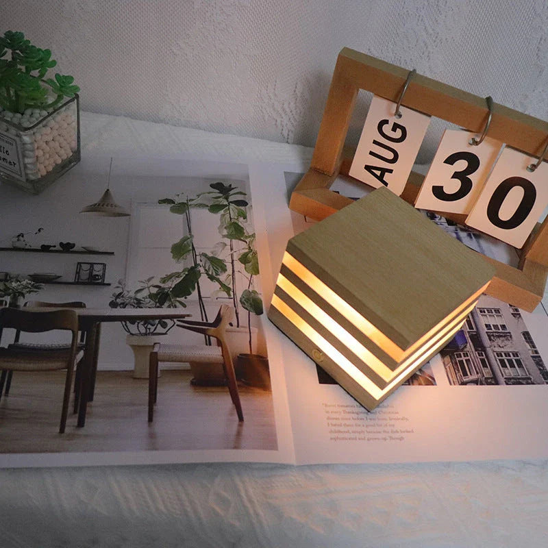 A warm, Scandinavian-inspired wooden LED night light in the shape of a heart or small house, providing cozy illumination for any room