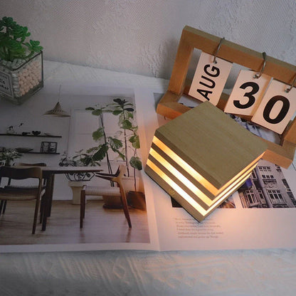 A warm, Scandinavian-inspired wooden LED night light in the shape of a heart or small house, providing cozy illumination for any room