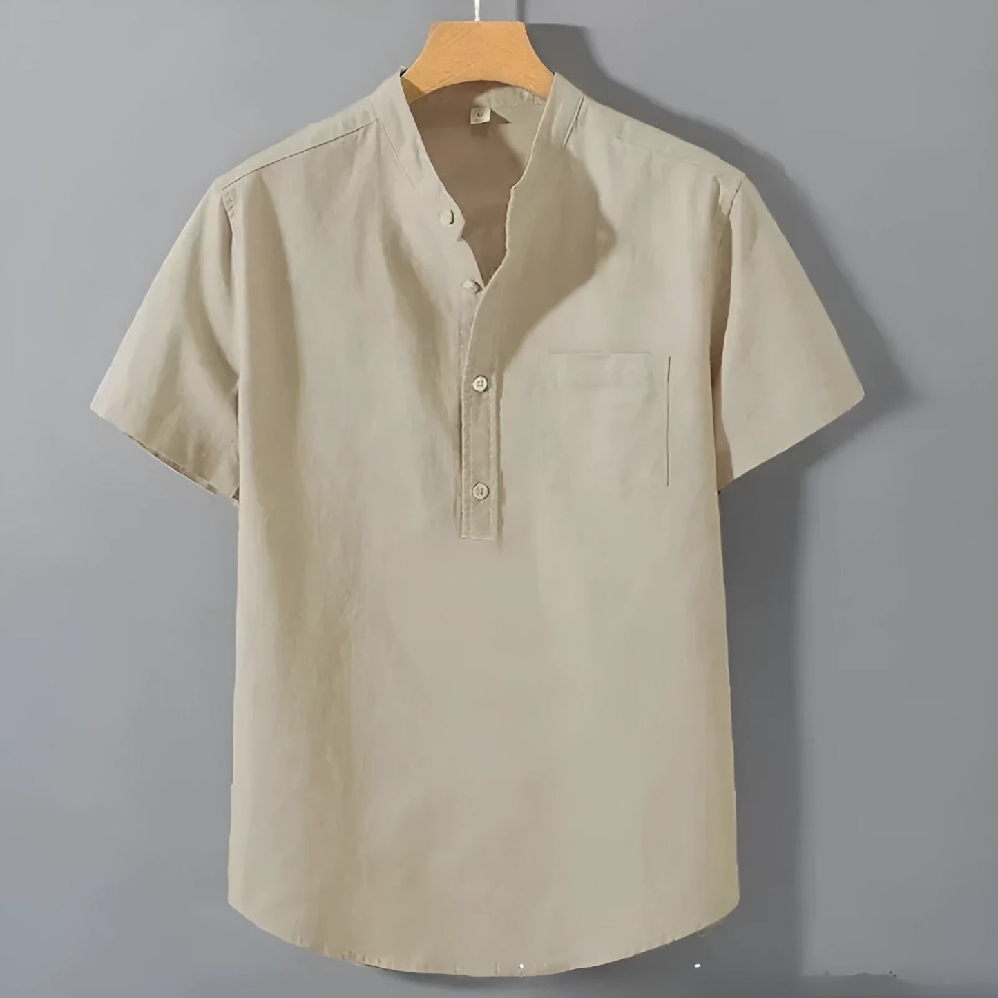 Men's casual beige linen-cotton shirt with stand collar and short sleeves on a hanger