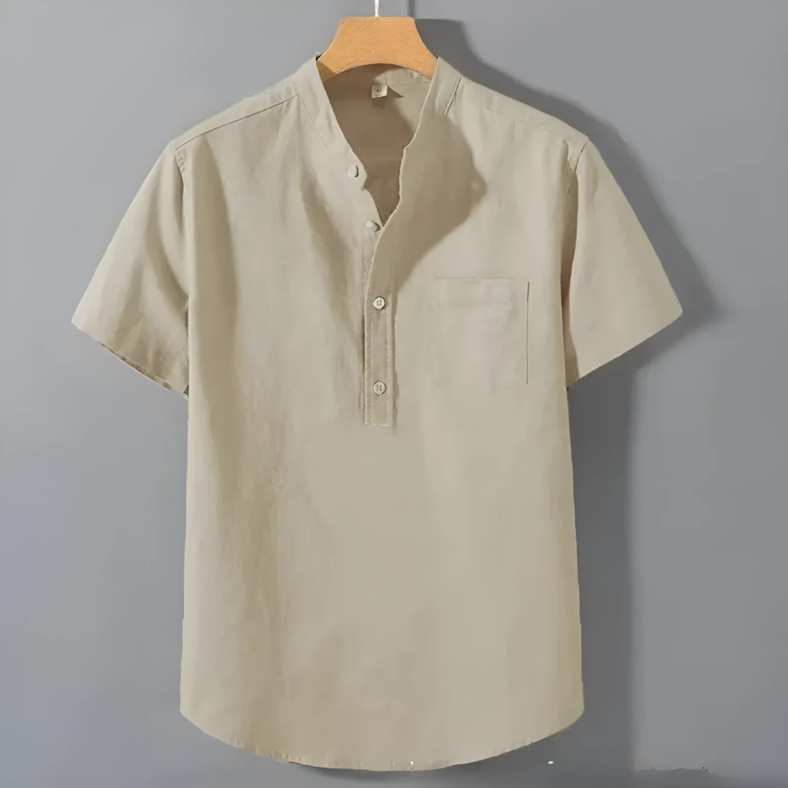Men's casual beige linen-cotton shirt with stand collar and short sleeves on a hanger