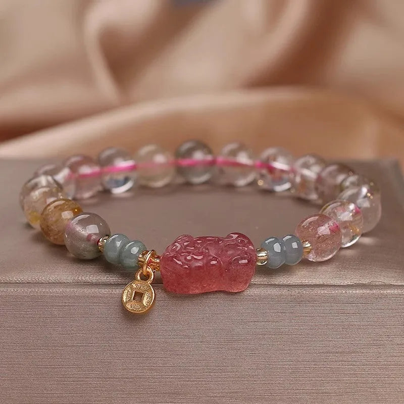 Colourful hair crystal stretch bracelet with cat's paw, butterfly, flower, and purse charms on adjustable band