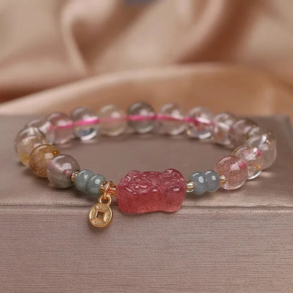 Colourful hair crystal stretch bracelet with cat's paw, butterfly, flower, and purse charms on adjustable band